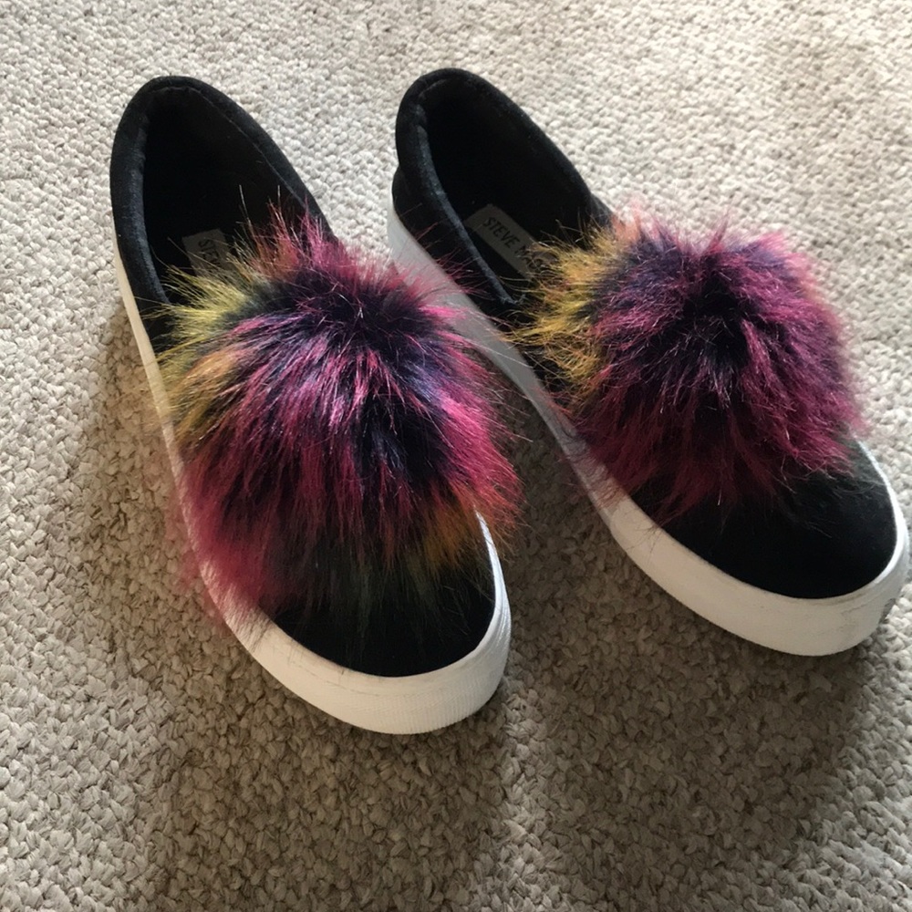 Black slip ons with puff ball